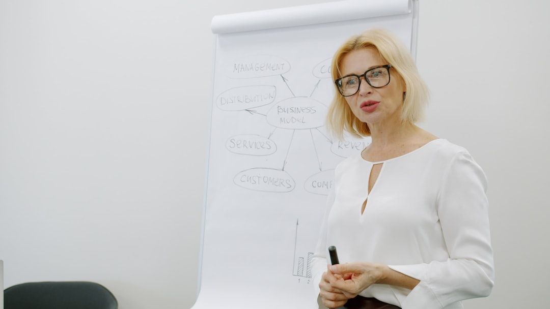 Experienced tutor explaining science concepts on whiteboard at Tampines tuition centre